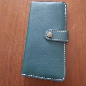 Peackick colored leather wallet with white stitching